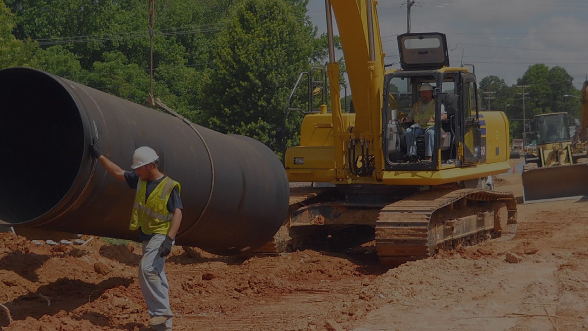 moving large pipe on o construction site